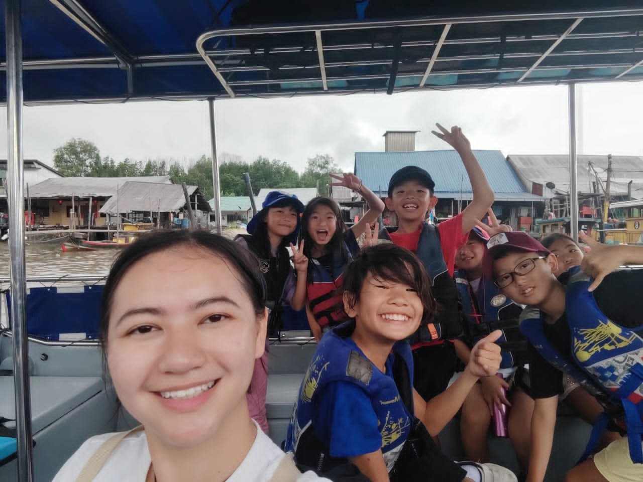 sharmaine and kids on the boat